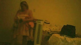 My lustful BBW wife changes her clothes in a bedroom