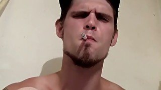 Smoking thug Nolan strokes his cock solo