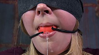 Poor blonde bitch with a star tattoo drooling herself in kinky bdsm play