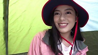 Adorable Japanese darling moans while riding a dick in a tent