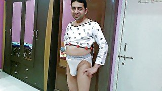 Hot crossdresser femboy Sweet Lollipop in a white crop top and thong.