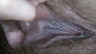 Lustful mature woman playing with her soaking vagina in closeup video