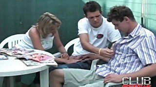 Girl blows a pair of bisexual guys outdoors