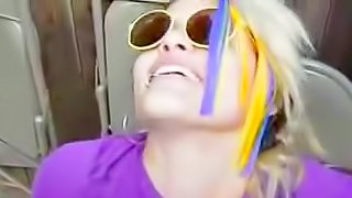 Smiling teen blonde is sucking outodoors