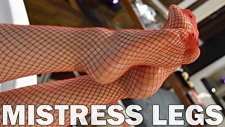 Pretty Mistress legs in red fishnet stockings