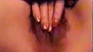 GF pleases her hairy pussy with hand