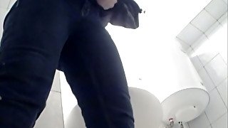 White chick in blue jeans filmed pissing in the toilet room