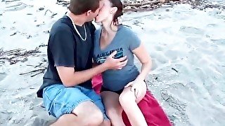 Kissing a cutie that sucks his dick on the beach