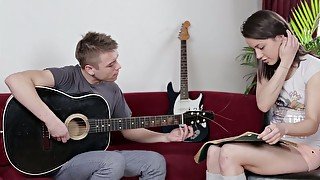 Raven haired teen seduces under sounds of guitar for some anal