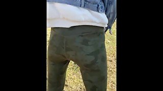 Chinese milf walk in park peeing in pants.