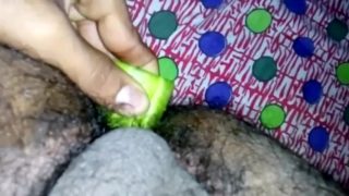 Inserting huge cucumber in asshole