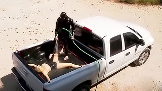 Rubber girl water play in the truck bed