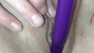 wife masturbates and puts a vibrator into her shaved pussy