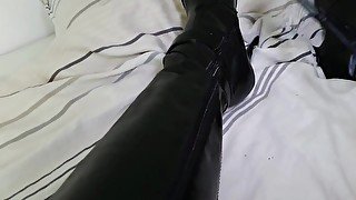 Whip spanking on leather boots