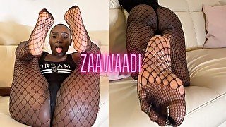 Footsie Ebony Zaawaadi gives POV footjobs in fishnets