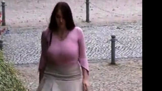 Busty girl walking, no bra, jiggling