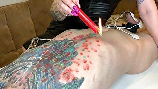 Hot Wax Games! Dominatrix pours wax on slave's body