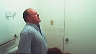 Chubby mature guy getting blowjob in the public restroom