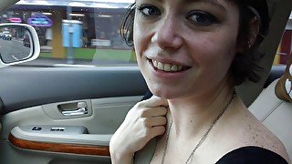 American brunette slut gives blowjob to her BF in a car.