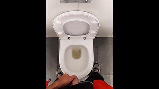 guy pissing in the airport toilet and jerking off