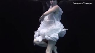 Graceful andrejka strips her dress off underwater