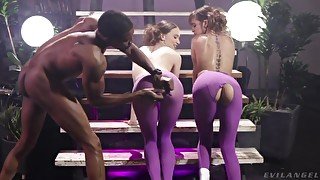 Black man fucks two white chicks in ripped purple leggings right on t the stairs