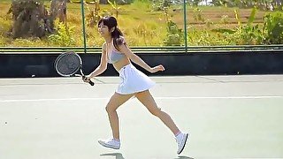 Sassy Asian girl Yuka Hirata plays tennis on the court