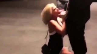 Striking blonde cougar displays her blowjob skills in public