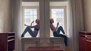 girls smoking on the window