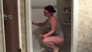 Hot milf cleaning the shower showing her ass