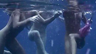 Hot babes get horny in the sea and touch bodies