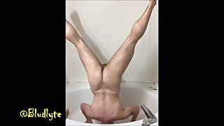 Trans man pisses all over himself in a headstand