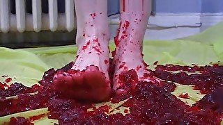 Girl gets feet messy with jello