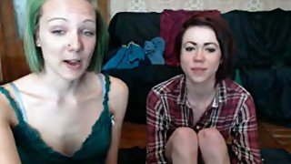 Pale red and green haired amateur lesbians tickle pussies on webcam