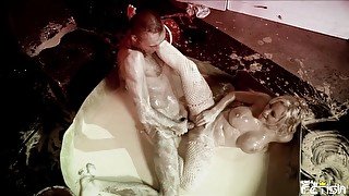 Busty blonde gets fucked by her horny photographer in a milk bath