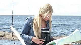 Lovely tanned blonde Lindsey B is masturbating her pussy on the yacht