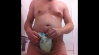 chav in golden shower wanking in piss soaked nappy