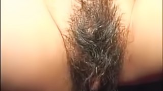 Asian chick shows off her hairy cunt and gives a blowjob