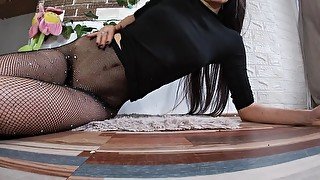 Girl with a Big Ass & Shiny Fishnet Stockings Jumps on a Dildo & Squirts