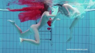 Two lovely girls make angel and demon show underwater