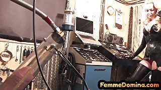 Latex BDSM femdom drains sissy cock with milking machine