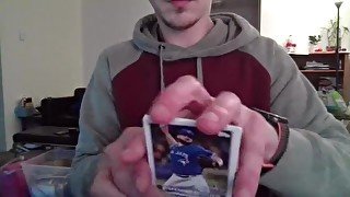 Cute Nerd Opening a Pack of Baesball Cards