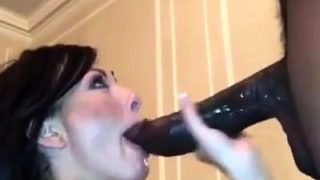 Ravishing brunette milf takes a huge black cock in her mouth