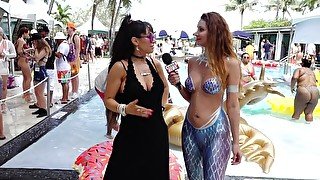 Porn Stars interviewed by Naked News reporter in mermaid body paint at Xbiz Miami poolside