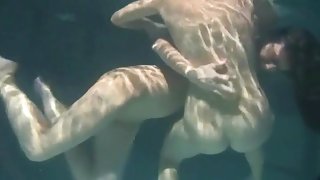 Girls grope and fondle underwater to arouse