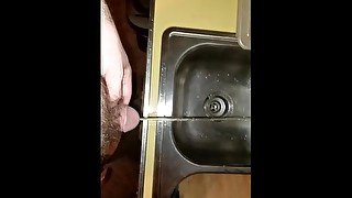 Sean takes a piss in the sink