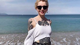 Tattooed teen eats Cum after oral play on the beach