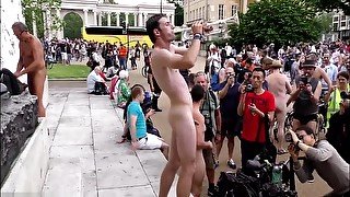 Sexy naked man plays trumpet in London town square