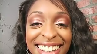 Busty ebony girl blows a cock in a gloryhole video