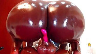 Oily ass on a big dildo